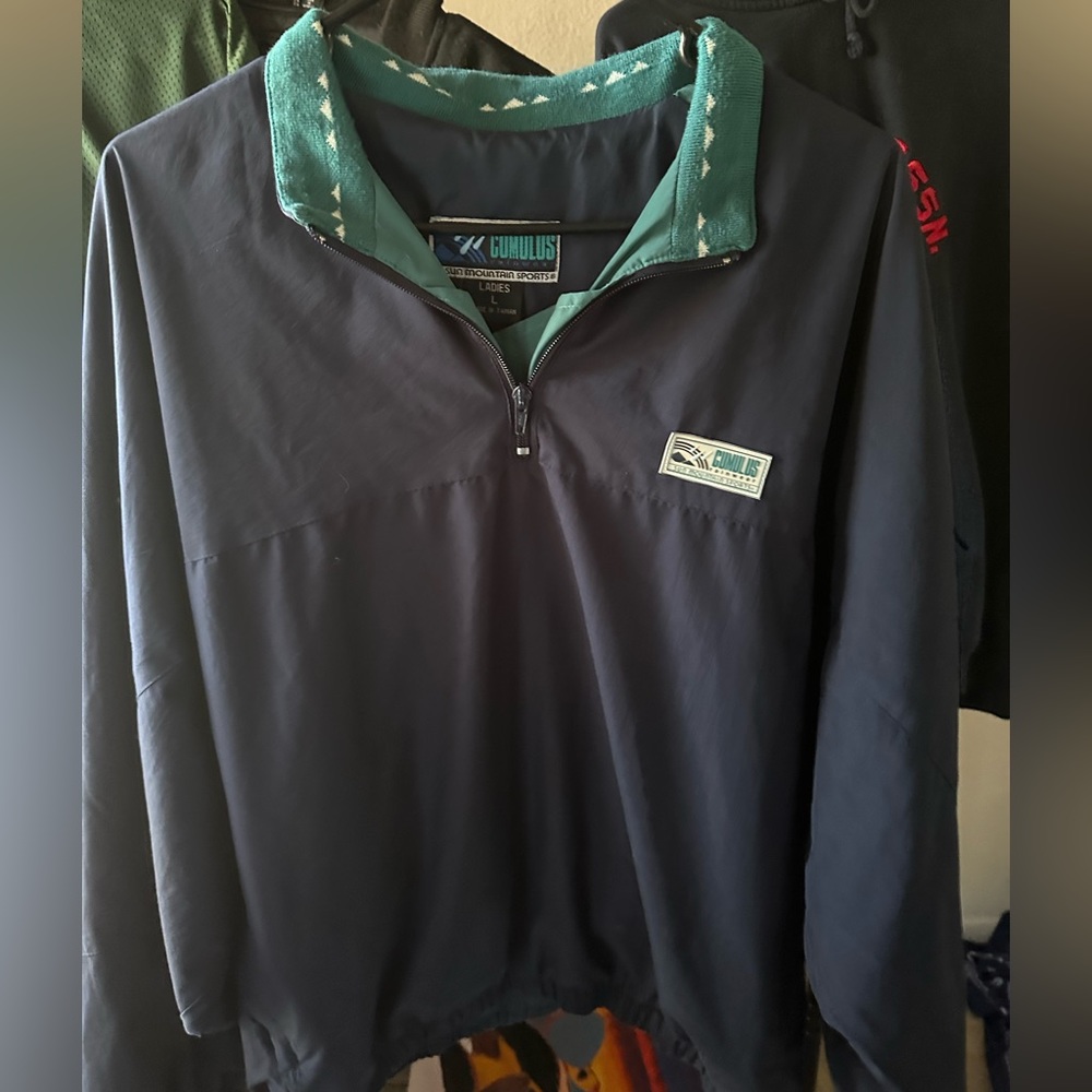 dark blue and green windbreaker bomber patterned design on the collar